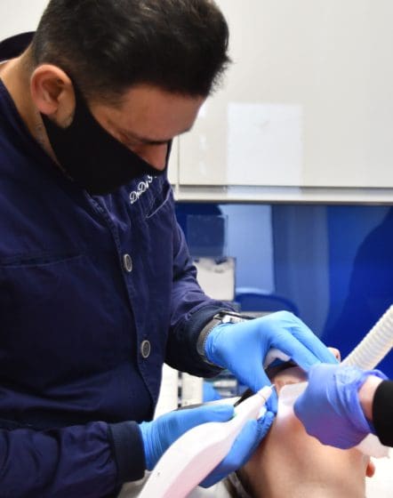 Dr Patel treating a patient using plexr plus