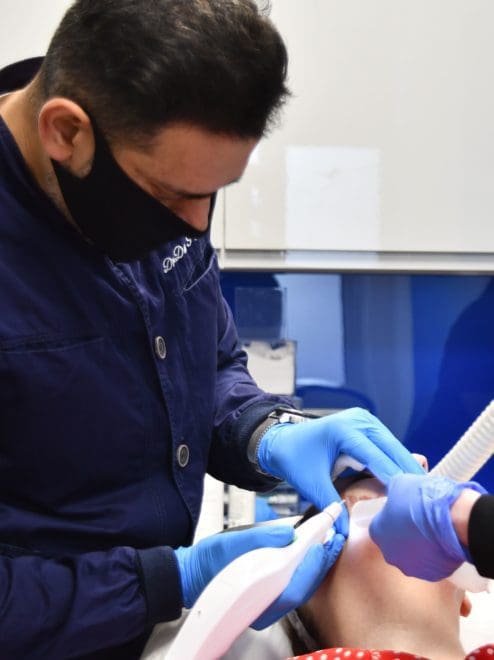 Dr Patel treating a patient using plexr plus