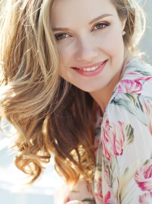 woman smiling in the sun